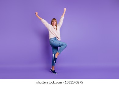 Full length body size view portrait of nice-looking attractive lovely cheerful cheery straight-haired lady having fun raising hands up isolated on bright vivid shine violet purple background - Shutterstock ID 1381140275