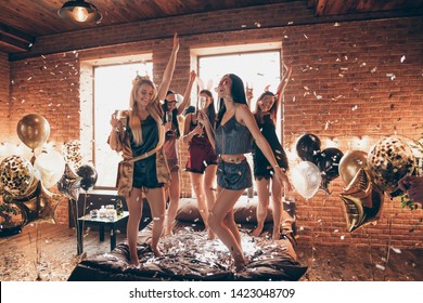 Full length body size view of nice attractive feminine lovely royal cheerful group having fun dancing on bed birthday in open space golden decorated loft industrial style interior room