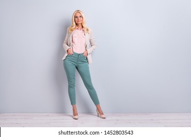 Full Length Body Size View Portrait Of Her She Nice Attractive Pretty Charming Stylish Content Cheerful Cheery Gray-haired Lady Holding Hands In Pockets Over Light White Gray Background