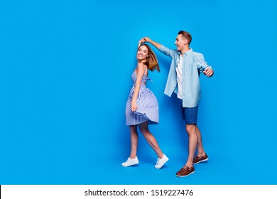 Full length body size view of her she his he two nice attractive charming lovely cheerful partners dancing spinning waltz isolated over bright vivid shine vibrant blue turquoise color background