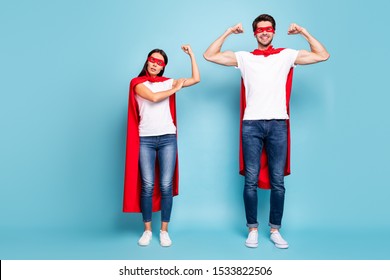 Full Length Body Size View Of Nice Competitive Cheery Sporty People In Red Hero Look Showing Arm Muscle Weak Female Gender Vs Masculine Isolated On Bright Vivid Shine Vibrant Blue Turquoise Background