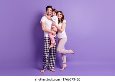 Full Length Body Size View Of Cheerful Careful Affectionate Family Three Person Embracing Wearing Pajama Harmony Isolated On Bright Vivid Shine Vibrant Violet Color Background