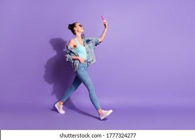 Full length body size view of her she nice attractive lovely fashionable glad cheerful girl going taking making selfie leisure isolated bright vivid shine vibrant lilac purple violet color background