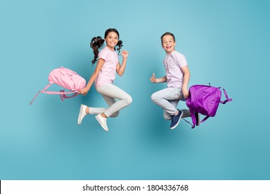 Full length body size view of his he her she nice attractive small little cheerful best friends friendship jumping having fun good mood free time leisure vacation isolated blue pastel color background - Shutterstock ID 1804336768