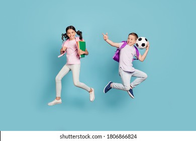 Full Length Body Size View Of His He Her She Attractive Small Little Cheerful Friends Friendship Jumping Having Fun Playing Football Cup Goal Free Time Isolated Blue Pastel Color Background