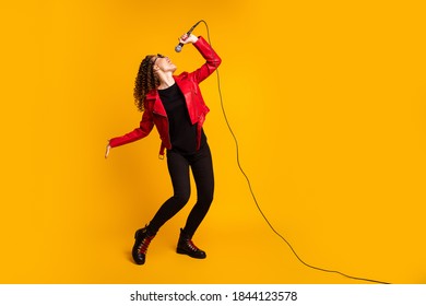 Full length body size view of talented cheerful wavy-haired girl musician singing hit isolated on bright yellow color background - Powered by Shutterstock