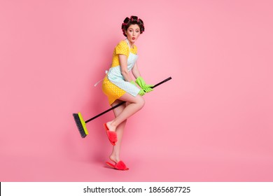 Full Length Body Size View Of Glamorous Childish Maid Riding Besom Like Horse Flying Pout Lips Isolated On Pink Color Background