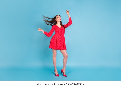 Full length body size view of attractive dreamy cheerful girl having fun rest relax event isolated over bright blue color background