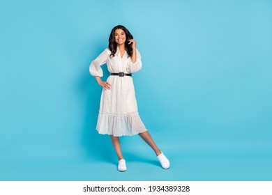 Full length body size view of attractive cheerful girl wearing cozy midi dress posing isolated over bright blue color background - Shutterstock ID 1934389328