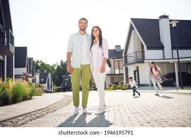 Full Length Body Size View Of Four Lovely Cheery People Family Hugging Move New Home Buying American Dream In Cottage Town Outdoor