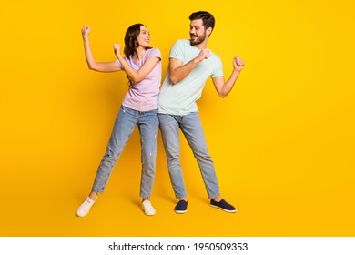 Full Length Body Size View Of Lovely Funny Cheerful Couple Dancing Having Fun Fooling Isolated Over Bright Yellow Color Background