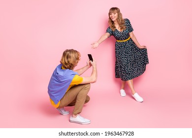 Full Length Body Size View Of Nice Cheerful Couple Having Fun Guy Taking Picture Girl Posing Dancing Isolated Over Pink Pastel Color Background