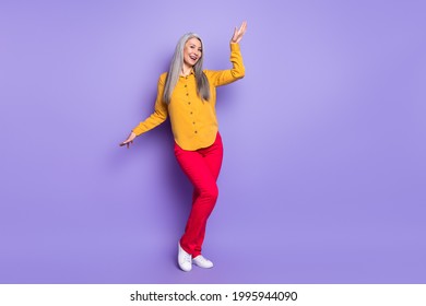 Full length body size view of pretty cheerful woman dancing having fun isolated over bright violet purple color background - Powered by Shutterstock