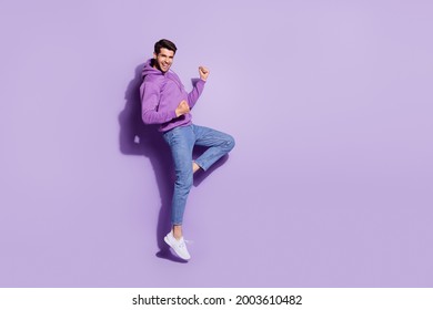 Full length body size view of attractive lucky cheerful guy jumping rejoicing great news isolated over purple violet color background - Shutterstock ID 2003610482