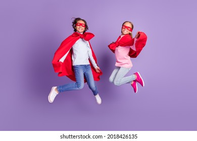 Full Length Body Size View Of Trendy Friends Friendship Kids Heroes Jumping Rescue Isolated Over Violet Purple Color Background