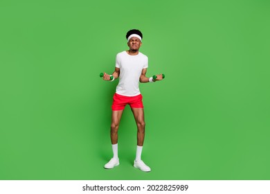 Full Length Body Size View Of Trendy Attractive Weak Guy Sportsman Doing Exercise Isolated Over Bright Green Color Background