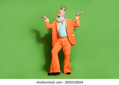Full length body size view of attractive cheerful funny man dancing fooling isolated over bright green color background