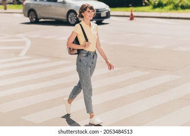 Full length body size view of attractive carefree cheerful girl walking traveling on fresh air outdoors