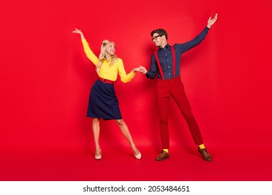 Full Length Body Size View Of Attractive Cheerful Couple Dancing Having Fun Isolated Over Bright Red Color Background