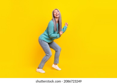 Full length body size view of attractive cheerful overjoyed grey-haired woman dancing enjoying isolated on bright yellow color background - Shutterstock ID 2086723249