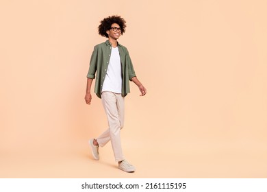 Full Length Body Size View Of Attractive Cheerful Smart Guy Going Isolated Over Beige Pastel Color Background