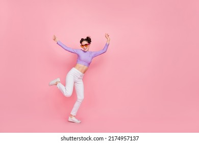 Full length body size view of attractive cheerful slender girl having fun disco club isolated over pink pastel color background