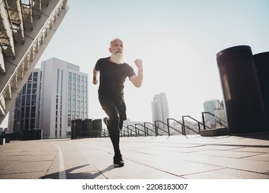 Full Length Body Size View Of Attractive Powerful Successful Motivated Elderly Grey-haired Man Running On Building Outdoors