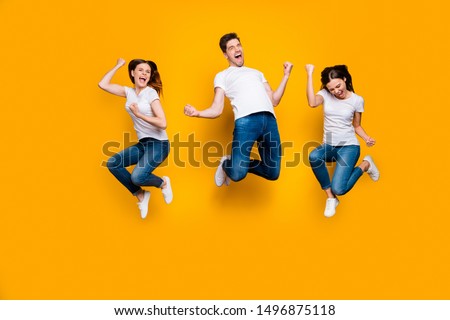 Full length body size view portrait of three nice attractive strong sporty satisfied cheerful cheery person having fun celebrating attainment isolated over bright vivid shine yellow background