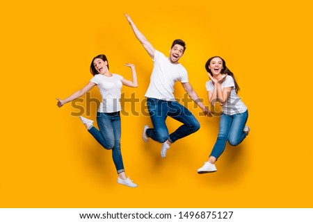 Full length body size view portrait of three nice attractive slim cheerful cheery comic foolish carefree careless person buddy fellow having fun isolated over bright vivid shine yellow background