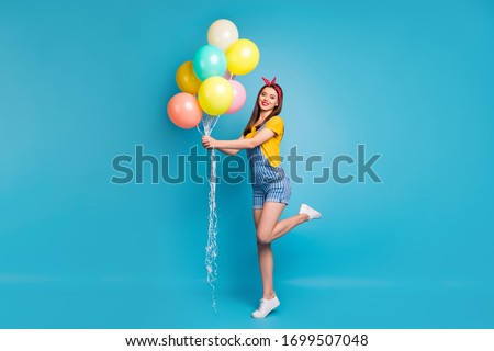 Full length body size view of her she nice attractive cheerful girl holding in hands bunch balls having fun isolated on bright vivid shine vibrant blue green teal turquoise color background