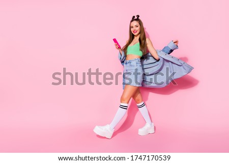 Full length body size view of her she nice attractive lovely slim fit thin tanned cheerful girl blogging using device app 5g going pastime glamour shadow isolated over pink pastel color background