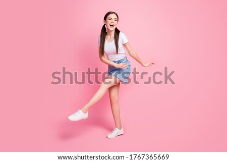 Full length body size view of her she nice attractive lovely charming pretty feminine glad cheerful cheery girl having fun time isolated over pink pastel color background