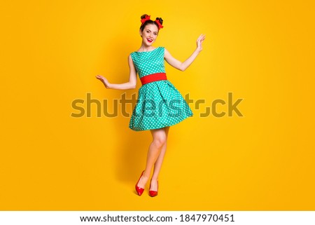 Full length body size view of nice-looking cheerful girl wearing teal dress posing having fun isolated over bright yellow color background