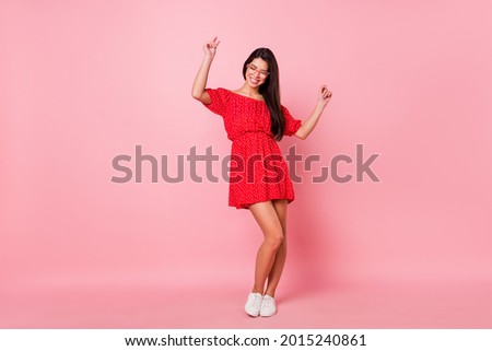 Full length body size view of attractive cheerful glad girl dancing celebrating isolated over pink pastel color background