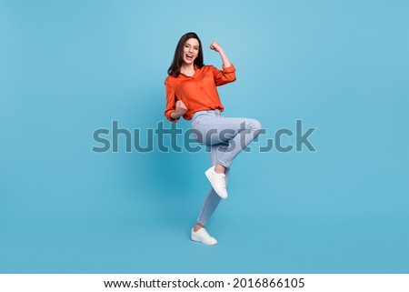 Full length body size view of attractive cheerful girl dancing having fun rejoicing isolated over bright blue color background