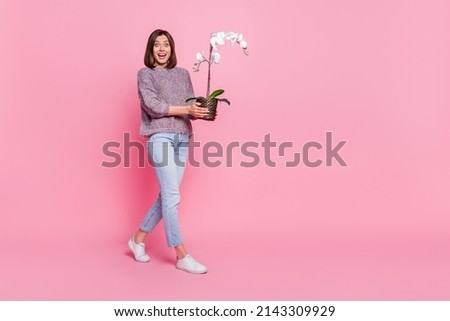 Similar – Image, Stock Photo Woman holding pink orchid