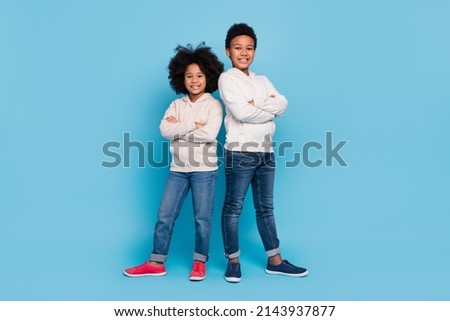 Full length body size view of attractive cheerful kids best support folded arms isolated over bright blue color background
