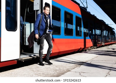 Full Length Of A Businessman Commuting To Work By Subway Train. 