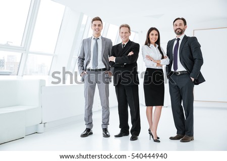 Similar – Image, Stock Photo Four people standing in a row on a ridge (2/2)