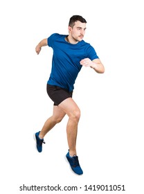 Full Length Of Determined Caucasian Man Athlete Fast Speed Running Isolated Over White Background. Young Guy Runner Wearing Black And Blue Sportswear Makes A Quick Sprint.