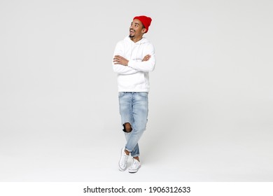 Full Length Of Excited Cheerful Surprised Young African American Man 20s Years Old In Casual Streetwear Hoodie Standing Hold Hands Crossed Looking Aside Isolated On White Background, Studio Portrait