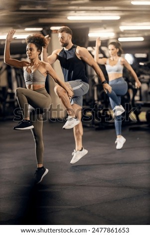 Similar – Image, Stock Photo Friends doing the training marked with a burpees series having a good time but accumulating fatigue.