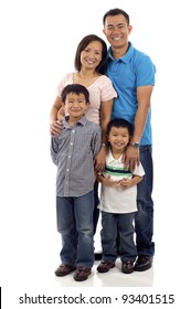 Full Length Of A Happy Asian Family Of Four Standing Isolated Over White Background