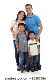 Full Length Of A Happy Asian Family Of Four Standing Isolated Over White Background