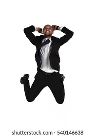 Full Length Happy Business Man In Black Suit Jumping In Studio Isolated On White Background