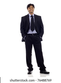 Full Length Of A  Happy Indian Business Man Standing With Hands In Pocket Isolated Over White Background. Studio Shot.