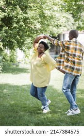 Full Length Of Happy Senior African American Couple Dancing In Park