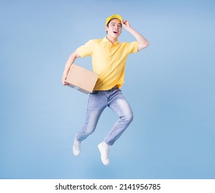 Full Length Image Of Asian Delivery Man On Blue Background