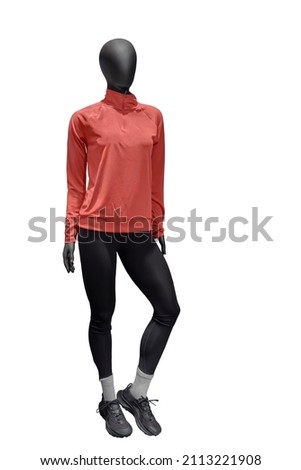 Full length image of a female display mannequin wearing sports suit isolated on a white background