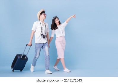 Full length image of young Asian couple travel, summer vacation